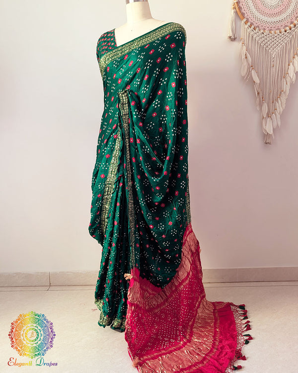 Green gaji silk saree palla highlighting Bandhani craftsmanship and Nakshi border