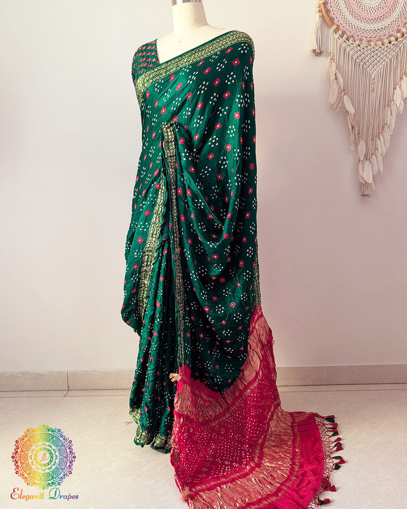 Green gaji silk saree palla highlighting Bandhani craftsmanship and Nakshi border