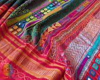 Detailed view of red palla with intricate Lambani hand embroidery