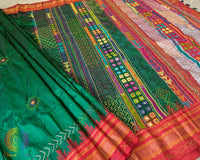 Pleats detail of green silk saree showing structured drape