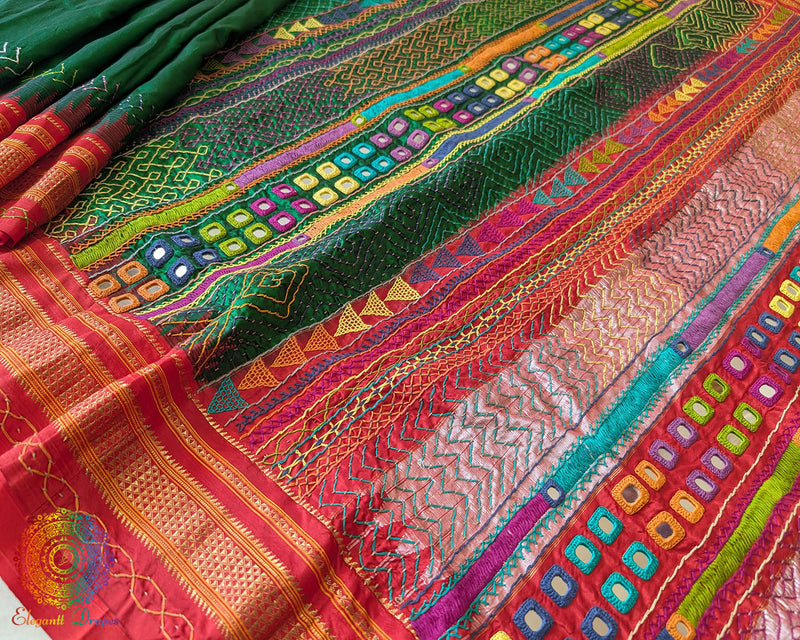Red palla close up on green Ilkal saree showcasing Lambani embroidery