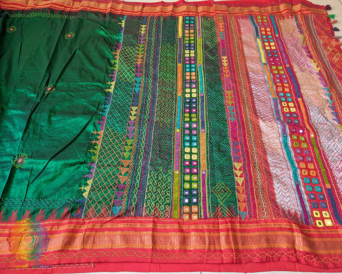 Full green Ilkal silk saree laid flat showing red palla and border