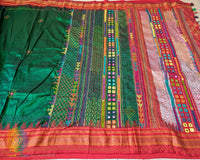Full green Ilkal silk saree laid flat showing red palla and border