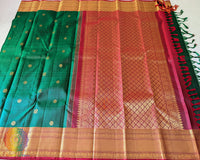 Detailed view of the gold zari border on the Green Pure Kanjivaram Handloom Silk Saree, showcasing the traditional woven patterns and golden accents.