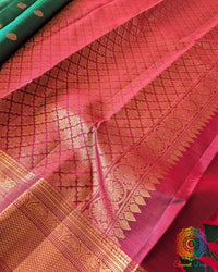 Close-up of the palla of the Green Pure Kanjivaram Silk Saree, highlighting the 1gm gold zari work and traditional handloom detailing.