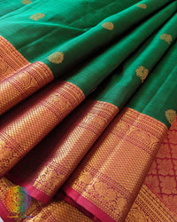 Detailed view of the pleats and gold zari design on the Green Pure Kanjivaram Handloom Silk Saree, showcasing the silk texture and traditional craftsmanship.
