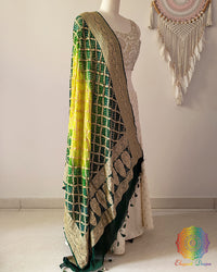 Side view of green shaded Banarasi georgette Gharchola Bandhani dupatta showcasing elegant ombré shading, Gharchola checks, and Bandhani motifs