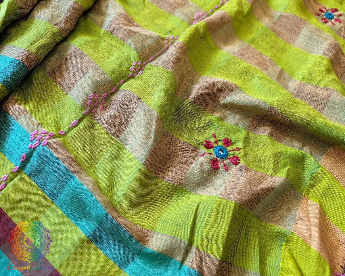 Detailed view of handcrafted Lambani embroidery on the checked Ilkal cotton saree