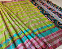 Parrot green checked Ilkal cotton saree highlighting decorative Lambani embroidered bels