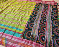Full drape of parrot green checked Ilkal cotton saree showcasing Lambani hand embroidery