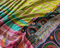 Close-up of intricate multicolored Lambani hand embroidery on the richly embellished palla