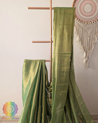 Close up of green Bengal mul tissue saree with sequins work