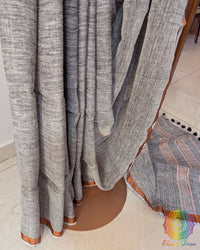 Pleats detail of grey linen saree showing texture and fall