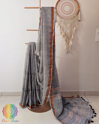 Grey linen saree with sequins on mannequin showing complete drape