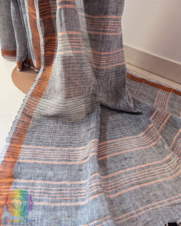 Sequin detail close up on grey linen saree highlighting subtle shimmer