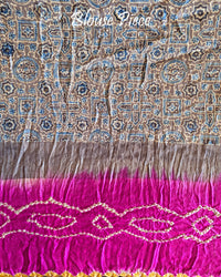 Matching blouse piece in grey Ajrakh fabric with magenta bandhani detailing