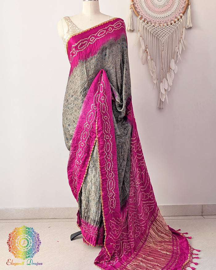 Grey Ajrakh saree with magenta bandhani palla on mannequin showing full drape