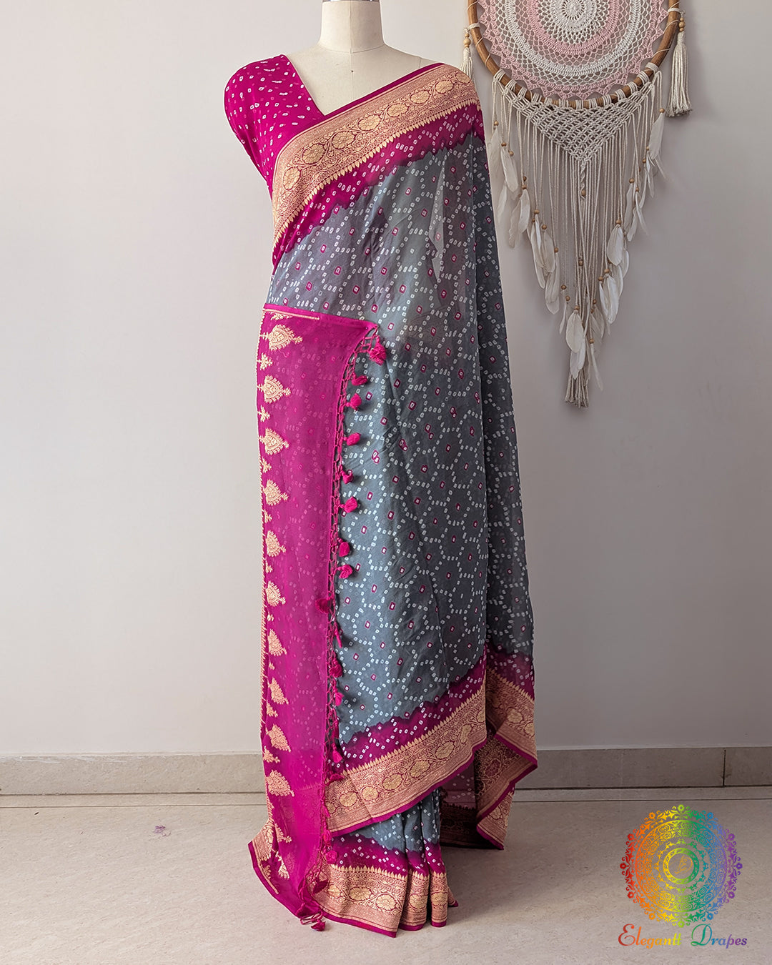 Grey Banarasi bandhani saree on mannequin showcasing pink border detail