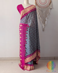 Grey Banarasi bandhani saree on mannequin showcasing pink border detail