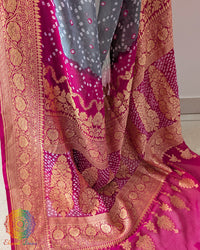 Pink palla close up on grey georgette bandhani saree highlighting detailing