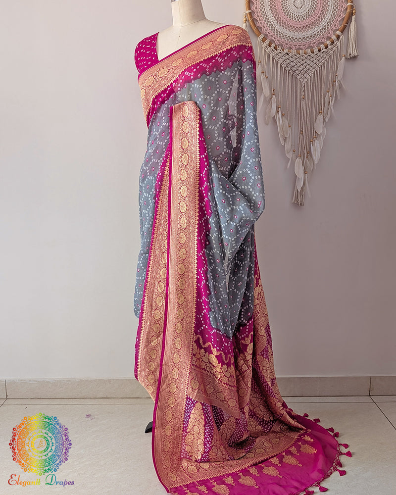 Side angle view of grey saree with pink palla highlighting graceful fall