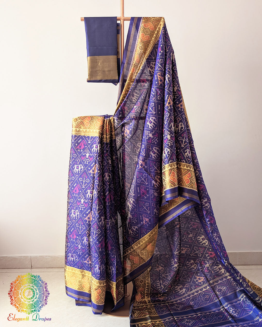 Indigo Blue Handwoven Mulberry Silk Rajkot Patola Saree – Full Drape View showcasing the rich indigo blue shade, traditional Rajkot Patola motifs and graceful drape of the handwoven mulberry silk saree, highlighting its elegant colour and traditional Gujarati craftsmanship.