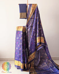 Indigo Blue Handwoven Mulberry Silk Rajkot Patola Saree – Full Drape View showcasing the rich indigo blue shade, traditional Rajkot Patola motifs and graceful drape of the handwoven mulberry silk saree, highlighting its elegant colour and traditional Gujarati craftsmanship.