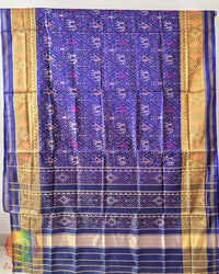Indigo Blue Handwoven Mulberry Silk Rajkot Patola Saree – Full Saree View displaying the complete saree with its deep indigo blue colour, intricate Patola patterns and lustrous silk texture, reflecting the beauty of traditional Gujarati weaving.