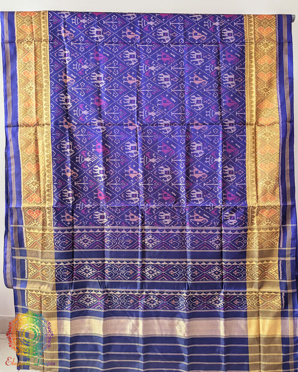 Indigo Blue Handwoven Mulberry Silk Rajkot Patola Saree – Full Saree View displaying the complete saree with its deep indigo blue colour, intricate Patola patterns and lustrous silk texture, reflecting the beauty of traditional Gujarati weaving.