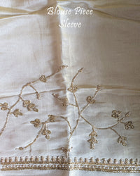 Matching blouse piece with coordinated Cutdana, pearl, and zardozi hand embroidery