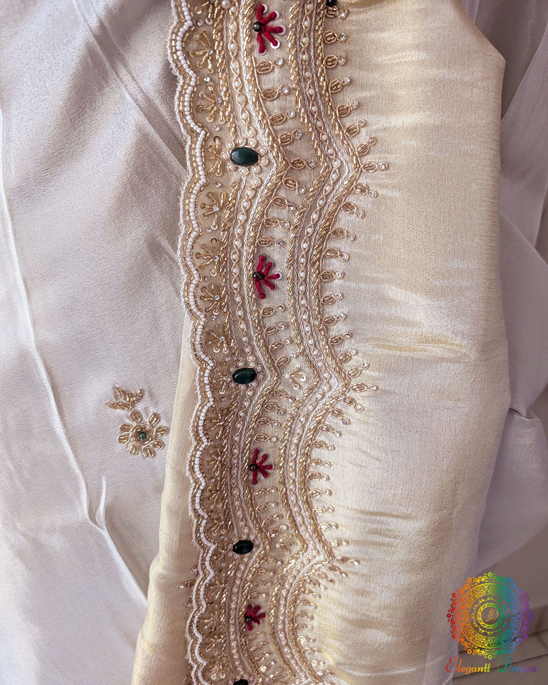 Close-up of the self-woven wave pattern, embroidered floral butis, and lustrous Soft Tissue Silk texture