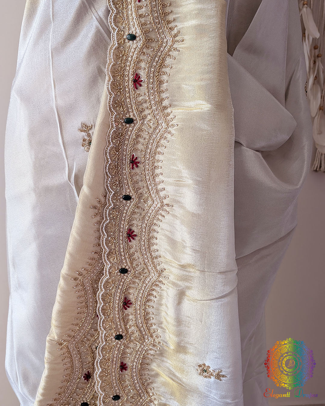 Close-up of the scalloped border featuring intricate Cutdana, pearl, and zardozi hand embroidery