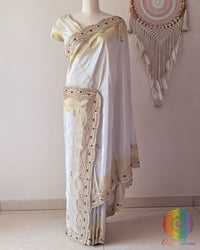 Full drape of Ivory Soft Tissue Silk saree showcasing elegant handcrafted border and natural sheen