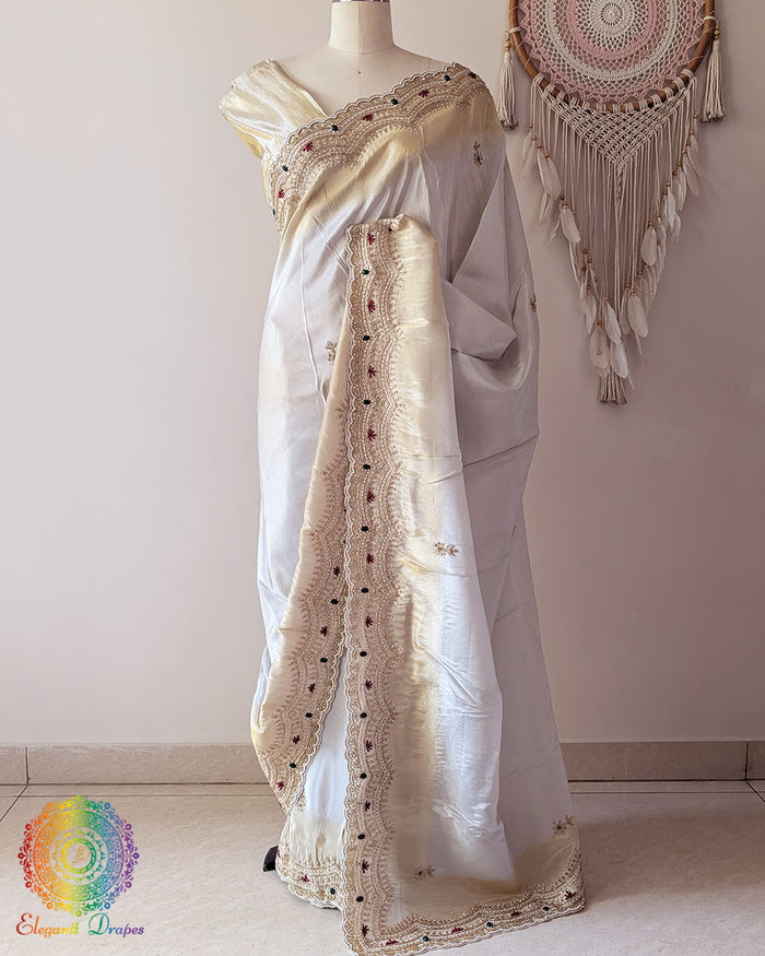 Ivory Soft Tissue Silk saree with scalloped Cutdana, pearl, and zardozi handwork border