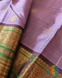 Close-up of wide green and gold zari border on Lavender Kanjivaram Silk Saree