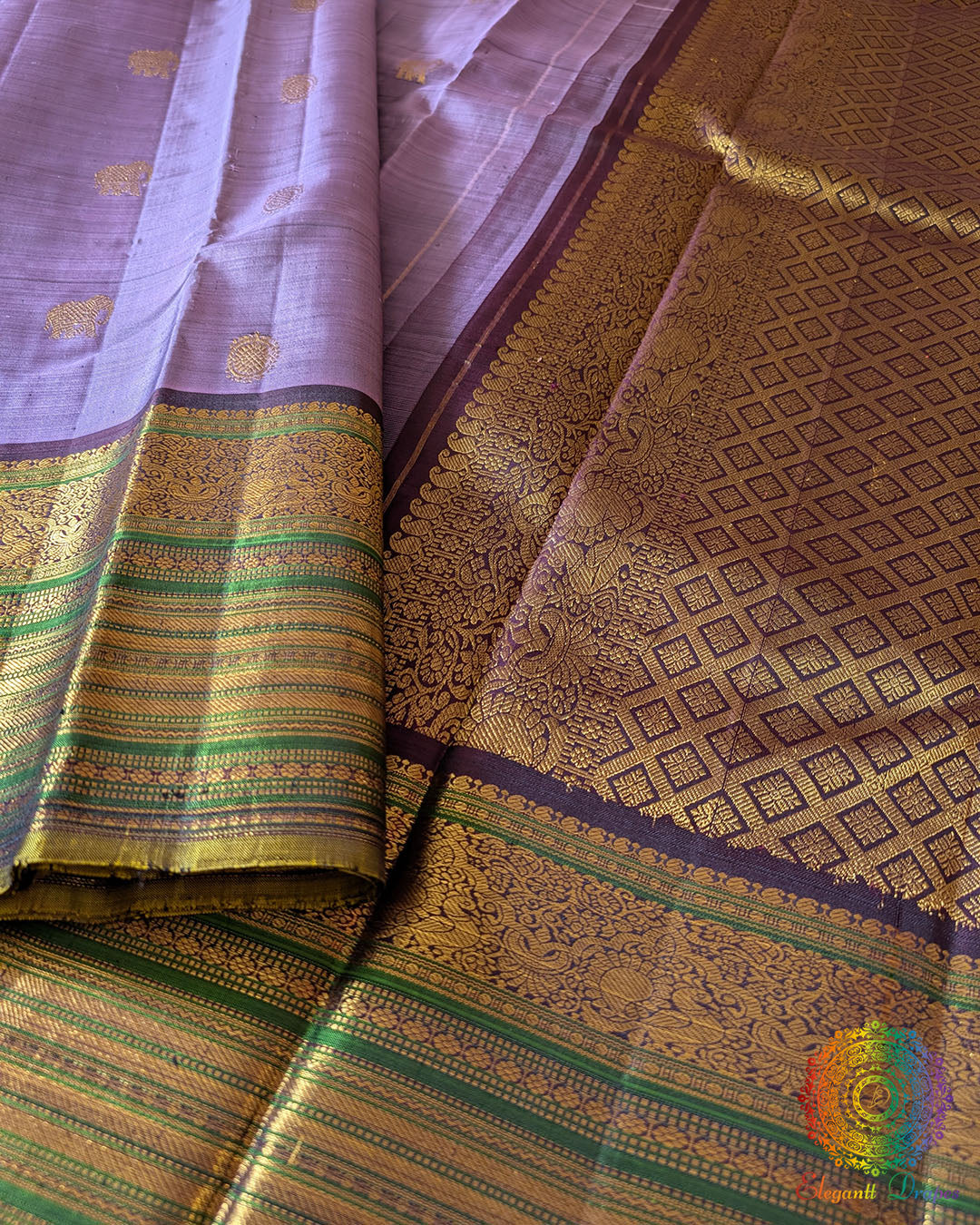 Close-up of wide green and gold zari border on Lavender Kanjivaram Silk Saree