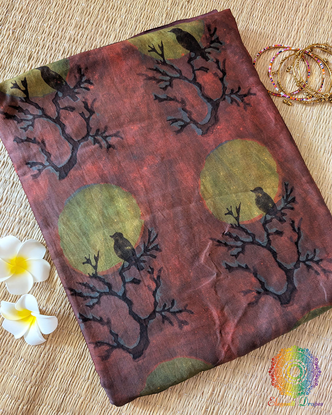Lavender Nashpal Pomegranate Ajrakh Modal Tussar Silk Saree folded to display its delicate lavender shade, Nashpal Pomegranate Ajrakh print and striped textile design.