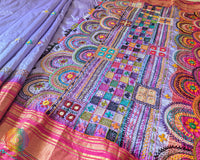 Pink border close up on lavender Ilkal silk saree highlighting embroidery