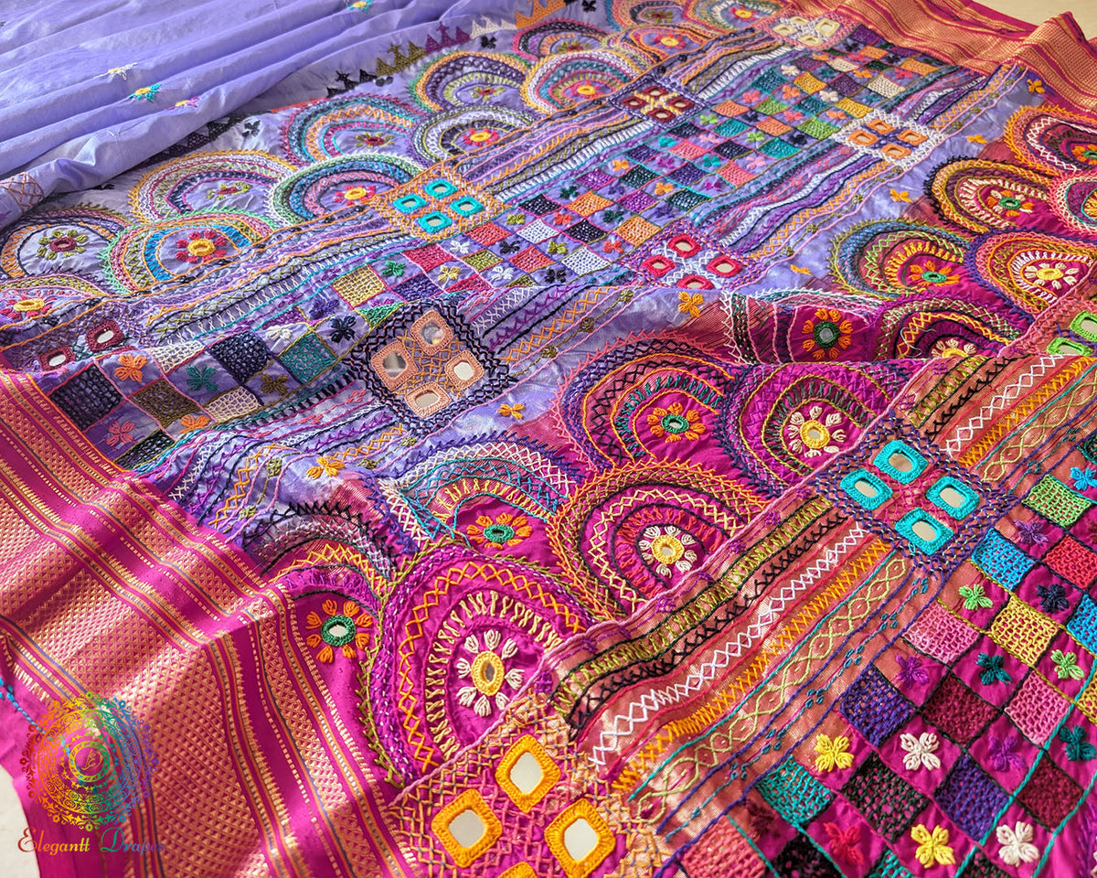 Pink palla close up on lavender Ilkal silk saree highlighting Lambani embroidery