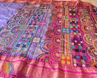 Intricate Lambani hand embroidery detail on lavender silk saree