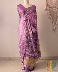 Pastel Lavender pure gaji silk saree on mannequin featuring all-over Bandhani dots and zari border
