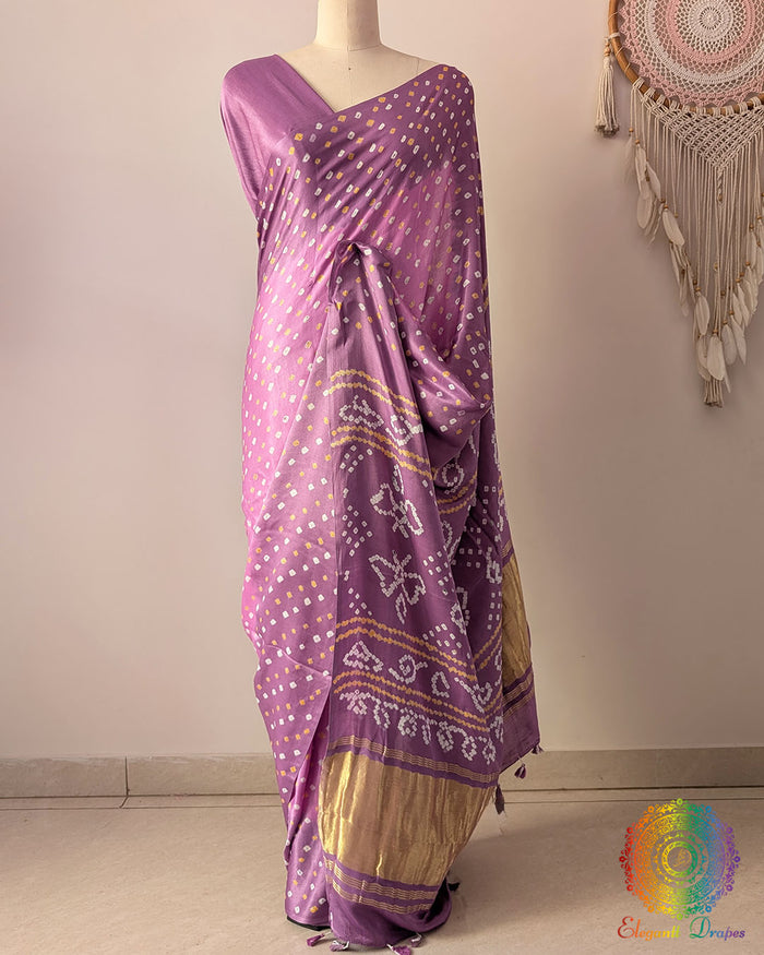 Pastel Lavender pure gaji silk saree on mannequin featuring all-over Bandhani dots and zari border