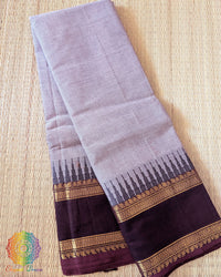 Folded lilac pink pure Kanchi cotton saree showing woven border detail