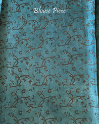 Blouse piece of the Lime Green Nashpal Pomegranate Ajrakh Modal Tussar Saree, showcasing its coordinating lime green colour and matching floral design.