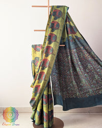 Lime Green Nashpal Pomegranate Ajrakh Modal Tussar Saree with the palla neatly pleated, highlighting the layered fabric and floral Nashpal Pomegranate Ajrakh pattern.