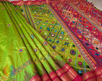 Close-up of the Sindur Lambani handwork on the Lime Green Pure Ilkal Silk Saree, displaying decorative threadwork and traditional folk-art patterns.