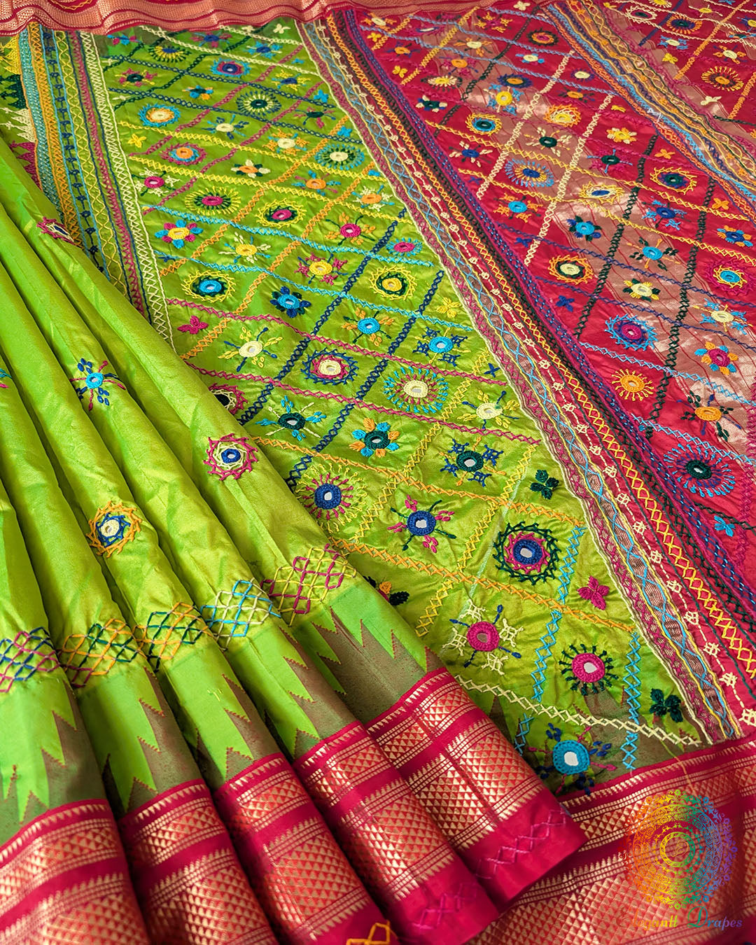 Lime Green Pure Ilkal Silk Saree with Sindur Lambani Handwork shown in a full open view, highlighting the vibrant lime green body with a contrasting red palla and border.