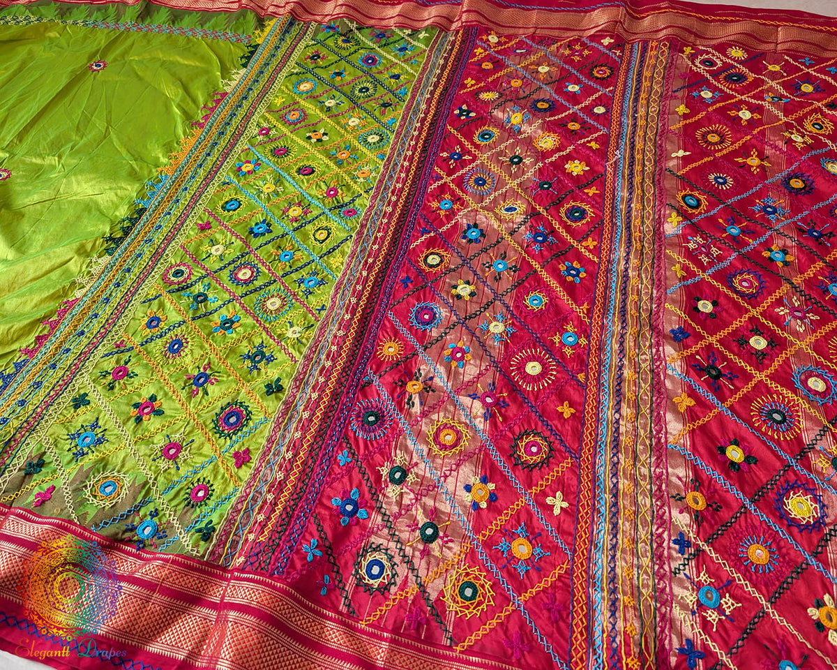 Full view of the Lime Green Pure Ilkal Silk Saree with Sindur Lambani Handwork, featuring the contrasting red palla and border against the vibrant green body.