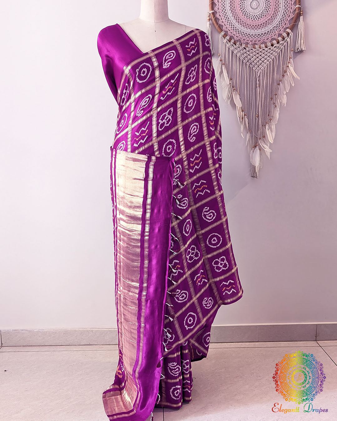 Close up of zari Gharchola checks and Bandhani motifs on berry purple pure gaji silk saree