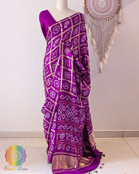 Berry purple Gharchola pure gaji silk Bandhani saree on mannequin with zari checks and Bandhani motifs